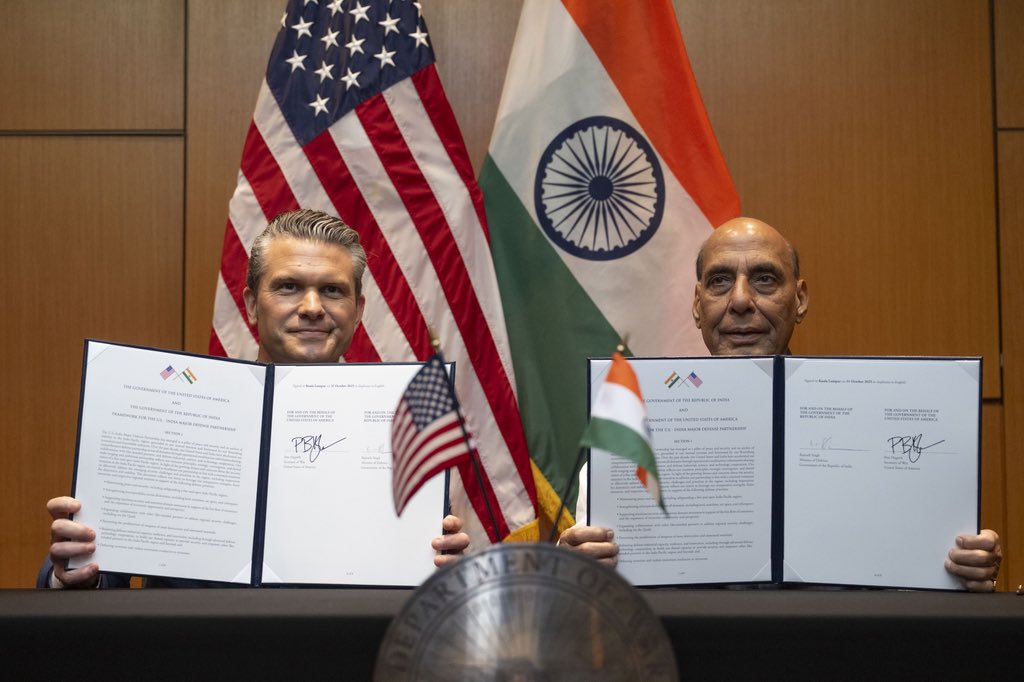 U.S. Secretary of War Pete Hegseth and Indian Defense Minister Rajnath Singh have signed a landmark 10-year defense framework in Kuala Lumpur during the ASEAN Defense Ministers’ Meeting. The deal deepens intelligence sharing, co-development of AI and drones, and joint weapons production to enhance Indo-Pacific security and deterrence.